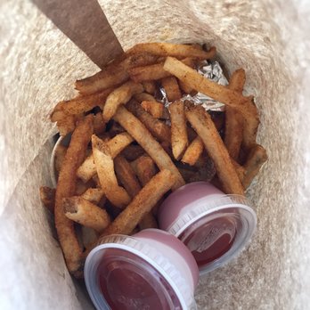 Five Guys - This is what the inside of the bag looks like. In other words, eat somewhere that you can wash your hands immediately after eating. - Burgers Near Me - Redmond, Washington