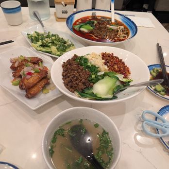 Highland Noodles - Garlic chicken wings, cucumber salad, dan dan noodle soup, and fried red chili flake noodles. - Noodles Near Me - Milpitas, California Highland Noodles - Garlic chicken wings, cucumber salad, dan dan noodle soup, and fried red chili flake noodles. - Noodles Near Me - Milpitas, California