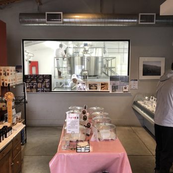 Nicasio Valley Cheese Company - Cheese tasting island with cheese making through the window - Cheese Shops Near Me - Nicasio, California Nicasio Valley Cheese Company - Cheese tasting island with cheese making through the window - Cheese Shops Near Me - Nicasio, California