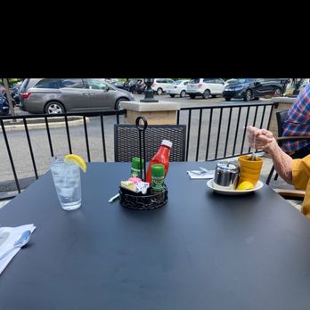 Yours Truly Restaurants - a table with a plate of food and a glass of water - Breakfast & Brunch Near Me - Hudson, Ohio Yours Truly Restaurants - a table with a plate of food and a glass of water - Breakfast & Brunch Near Me - Hudson, Ohio
