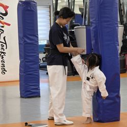 Doha Taekwondo - Master Tan stretching my daughter.
