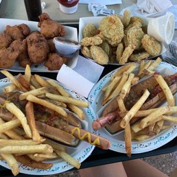 Footling hotdogs with fries, corn fritters, fried pickles. Footling hotdogs with fries, corn fritters, fried pickles.