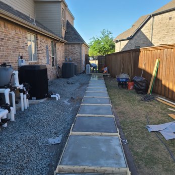 Olin Landscape Maintenance - a walkway being built in a back yard - Landscaping Near Me Olin Landscape Maintenance - a walkway being built in a back yard - Landscaping Near Me
