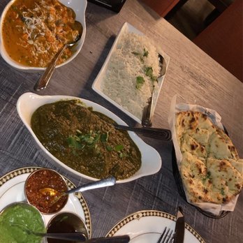 Tandoori Palace - Chicken saagwala (green), vegetable tikka masala (orange), garlic naan, basmati rice - Indian Near Me - Encinitas, California