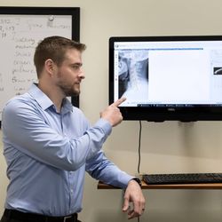 Mainspring Chiropractic - Dr John explaining a neck X-ray.