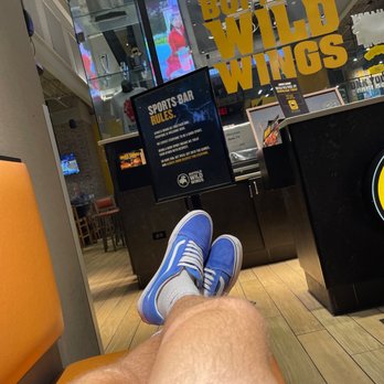 Buffalo Wild Wings - a man's legs with blue sneakers - American Near Me - Warrington, Pennsylvania Buffalo Wild Wings - a man's legs with blue sneakers - American Near Me - Warrington, Pennsylvania