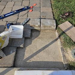 Village Land & Lighting - Irrigation Services & Masonry Construction