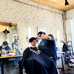 Square Deal Barbershop - My step-son getting his hair cut with Frank.