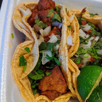 Mercado Acapulco - A couple pastor (marinated grilled pork) tacos. $2 each. - Mexican Near Me - Atlanta, Georgia