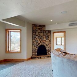 Lone Star Stucco & Stone - River rock fire place