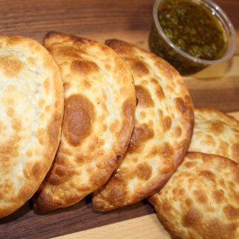Epaa! Empanadas - a pile of empanadas on a cutting board - Food Delivery Services Near Me - Lake Forest, California