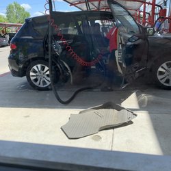 Rowlett Car Wash - Cleaning the interior and floor mats.