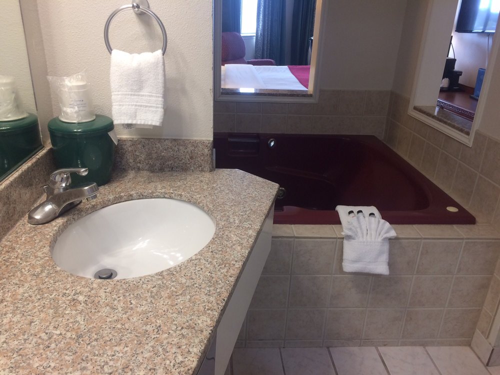 Granite Countertops Luxe Burgundy Porcelains Jacuzzi Tub In An