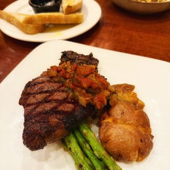 Hudson's Bar And Grill - Ribeye with tomato jam, asparagus, and smashed potatoes. - New American Near Me - Vancouver, Washington Hudson's Bar And Grill - Ribeye with tomato jam, asparagus, and smashed potatoes. - New American Near Me - Vancouver, Washington