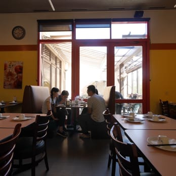 Chengdu Style Restaurant - Diners in booths facing second outdoor seating patio. - Szechuan Near Me - Berkeley, California