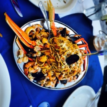 Poseidon - Seafood linguine and lobster and king crab legs - Greek Near Me - Miami Beach, Florida Poseidon - Seafood linguine and lobster and king crab legs - Greek Near Me - Miami Beach, Florida
