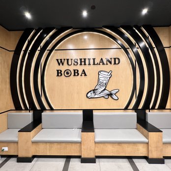 Wushiland Boba - Interior seating area with the Wushiland sign - Coffee & Tea Near Me - Arcadia, California Wushiland Boba - Interior seating area with the Wushiland sign - Coffee & Tea Near Me - Arcadia, California