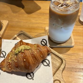 Equilibrio Coffee House - Pistachio croissant and iced latte - Coffee & Tea Near Me - Weston, Florida