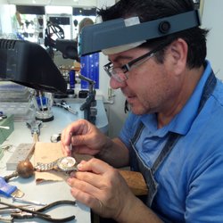 Jeweler Pablo Camelo works on a watch