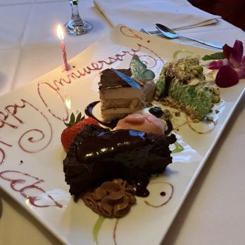Papillon - Dessert plate of tiramisu, raspberry sorbet, flourless chocolate cake, and Dubai cheesecake - French Near Me - Fremont, California Papillon - Dessert plate of tiramisu, raspberry sorbet, flourless chocolate cake, and Dubai cheesecake - French Near Me - Fremont, California