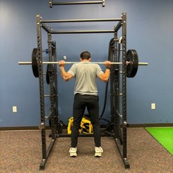 Grand Oaks Sports Medicine and Rehabilitation - Patient on squat rack