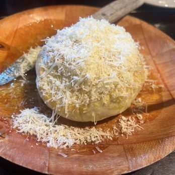 Trio - A Brick Oven Cafe - Table bread (shredded cheese and garlic oil) - Italian Near Me - Greenville, South Carolina Trio - A Brick Oven Cafe - Table bread (shredded cheese and garlic oil) - Italian Near Me - Greenville, South Carolina