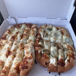 Roma Pizza - Cheese breadsticks on left, jalapeño popper break sticks on right