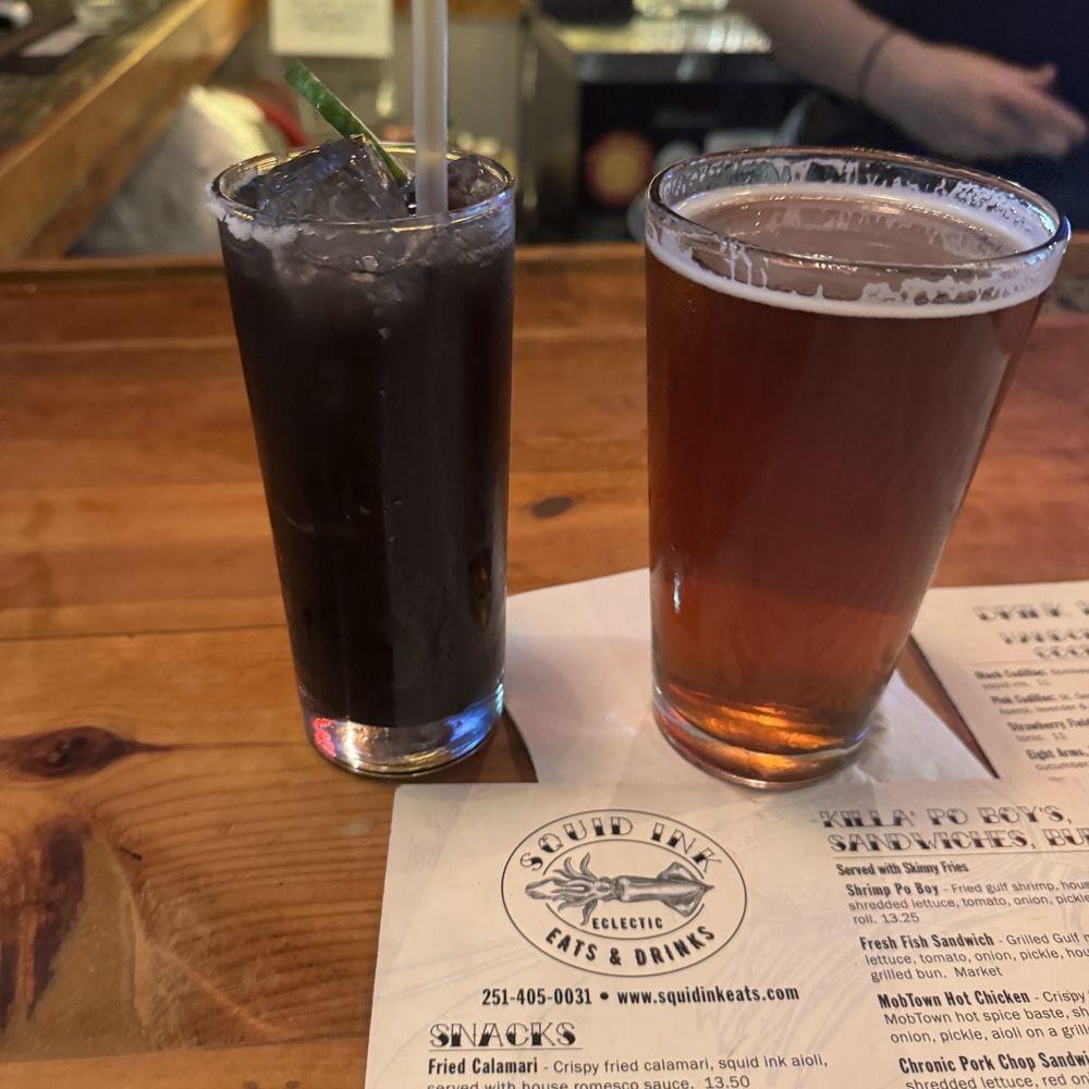 Squid Ink Eclectic Eats & Drinks - Squid eye cocktail and amber - Gastropubs Near Me - Mobile, Alabama Squid Ink Eclectic Eats & Drinks - Squid eye cocktail and amber - Gastropubs Near Me - Mobile, Alabama