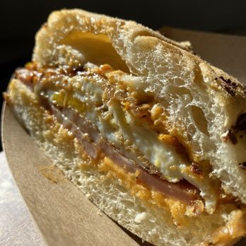 The Disgruntled Chef - Fried Mortadella $12 Cohen's Onion Kaiser with Fried Mortadella, Two Eggs, Cheddar Cheese, and Griddled Peppers and Onions - Coffee & Tea Near Me - Gardiner, New York