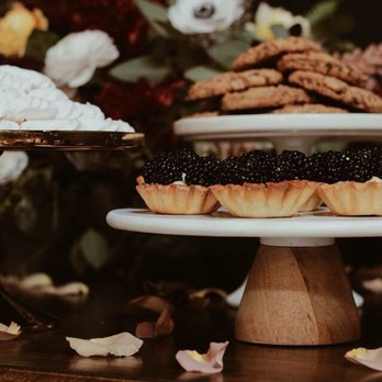 Petite Astorias - a variety of desserts on a table - Desserts Near Me Petite Astorias - a variety of desserts on a table - Desserts Near Me