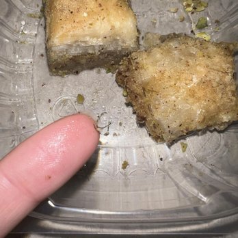 Naara Cafe - The photo shows me holding it after pulling it out of the dessert. - Middle Eastern Near Me - San Antonio, Texas