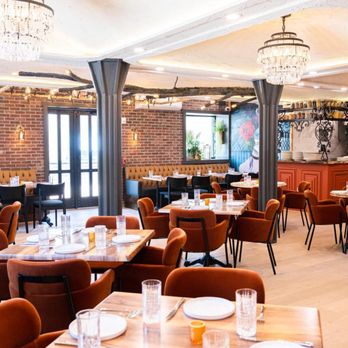 Toca vez - a dining room with tables and chairs - Mexican Near Me - Basking Ridge, New Jersey
