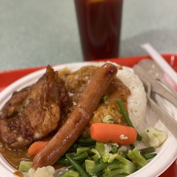 Parker Place - Onion chicken steak and crispy sausage on rice + iced lemon tea $14. from One Cafe - Shopping Centers Near Me - Richmond, British Columbia Parker Place - Onion chicken steak and crispy sausage on rice + iced lemon tea $14. from One Cafe - Shopping Centers Near Me - Richmond, British Columbia