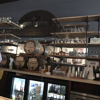 Grand Traverse Distillery - a man standing at the bar - Distilleries Near Me - Traverse City, Michigan Grand Traverse Distillery - a man standing at the bar - Distilleries Near Me - Traverse City, Michigan