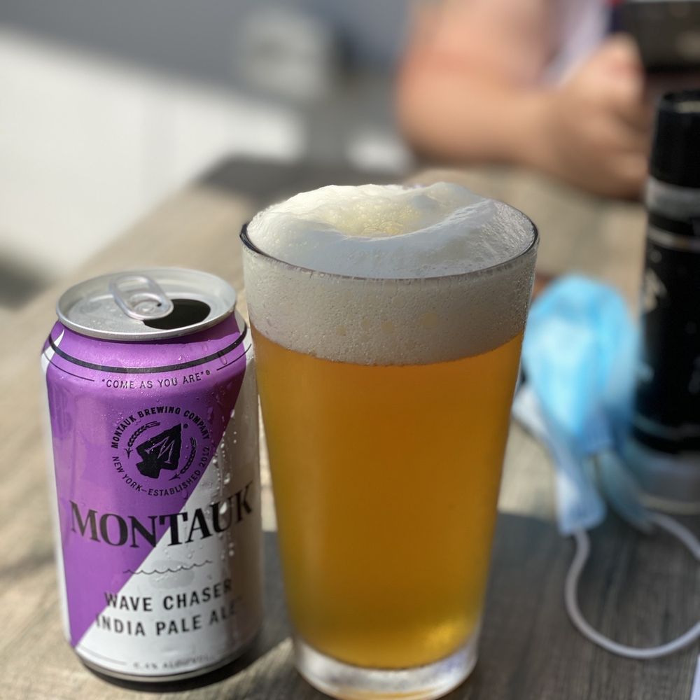 MTK Lobster House - a glass of beer and a can - Seafood Near Me - Montauk, New York MTK Lobster House - a glass of beer and a can - Seafood Near Me - Montauk, New York