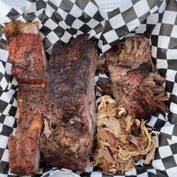 Smokin’ Ruben’s - Our All Meat Sampler comes with 1/4 pound of brisket, 1/4 pound of pulled pork, 1 beef rib & 1 pork rib. Delicious!!!