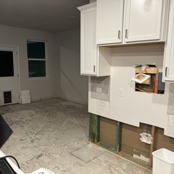 Taylor Morrison Homes - The "finished" dining room is hardly amazing to look at. The leak was behind the fridge.