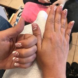 T J Nails