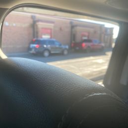 a view of a street through a car window