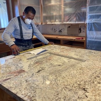 Plamar USA Kitchen Countertops - Vladimir measuring for the stove cutout. - General Contractors Near Me - San Jose, California Plamar USA Kitchen Countertops - Vladimir measuring for the stove cutout. - General Contractors Near Me - San Jose, California