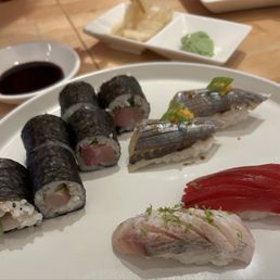 Scallion maki roll, mackerel nigiri, amberjack nigiri, tuba nigiri Scallion maki roll, mackerel nigiri, amberjack nigiri, tuba nigiri