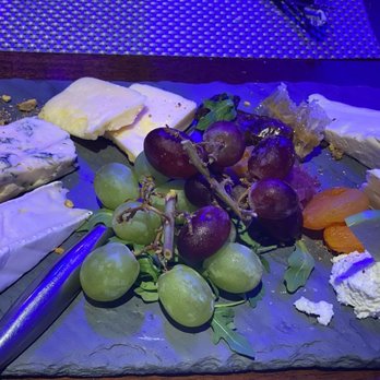 C Level Wine Bar - cheese and grapes on a slate platter - Tapas Bars Near Me - Bonita Springs, Florida C Level Wine Bar - cheese and grapes on a slate platter - Tapas Bars Near Me - Bonita Springs, Florida
