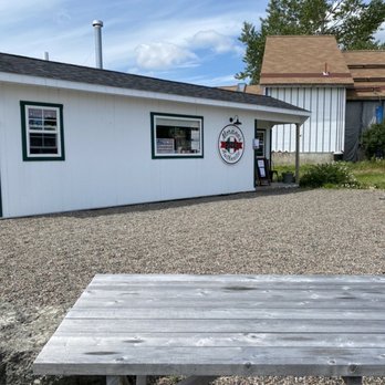 Morano's Authentic Pizza - a picnic table in front of a building - Pizza Near Me - Lubec, Maine