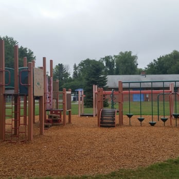 Elm Ridge Park - Climbing side of the 5-12 year olds Play Structure with Pool in the background - Parks Near Me - Rocky Hill, Connecticut Elm Ridge Park - Climbing side of the 5-12 year olds Play Structure with Pool in the background - Parks Near Me - Rocky Hill, Connecticut