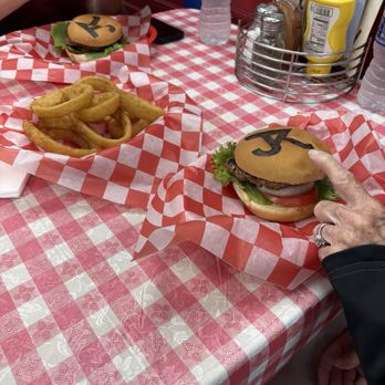Rowdy T Burger Stop - Huge regular burger with onion rings. - Burgers Near Me - Italy, Texas Rowdy T Burger Stop - Huge regular burger with onion rings. - Burgers Near Me - Italy, Texas
