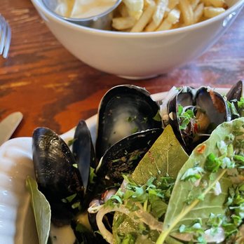 Le Bouchon - Mussels and frites brighten the mood for me and my friend on a gloomy, overcast day. So full of herbs and creamy broth. Decadent! - French Near Me - Chicago, Illinois Le Bouchon - Mussels and frites brighten the mood for me and my friend on a gloomy, overcast day. So full of herbs and creamy broth. Decadent! - French Near Me - Chicago, Illinois