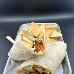Dreadnought Brewing - Three tenders smothered in house hot sauce and Nashville hot butter, with dill and spicy pickle spears, house fries, Chihuahua cheese, bacon