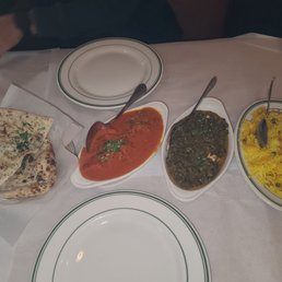 Left to right: garlic Naan, chicken Tikka masala, saag paneer, saffron rice Left to right: garlic Naan, chicken Tikka masala, saag paneer, saffron rice