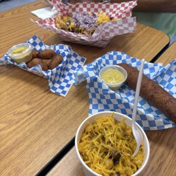 Jumbo corn dog, mini corn dogs, chili cheese fries, and chili mac. Jumbo corn dog, mini corn dogs, chili cheese fries, and chili mac.