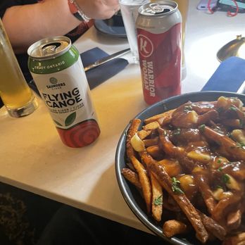 Lord Elgin Hotel - Poutine, cider, and beer at restaurant - Hotels Near Me - Ottawa, Ontario